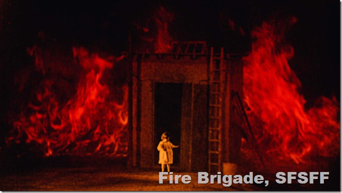 A small child appears to be surrounded by vivid red flames