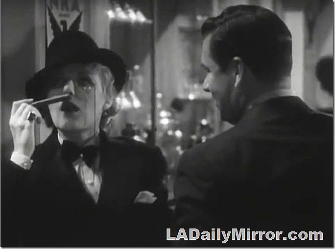 Dapper mystery guest sniffs a cigar. 